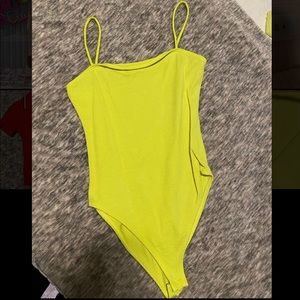 Neon yellow; highlight color bodysuit .Size Small